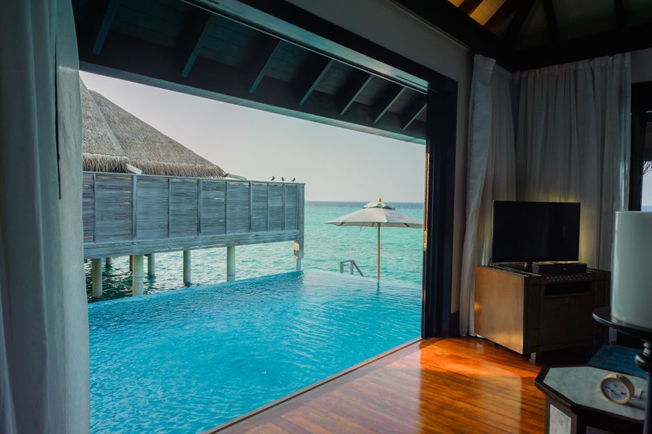 Luxury Maldives Private Island Overwater Villa with Infinity Pool and Turquoise Lagoon